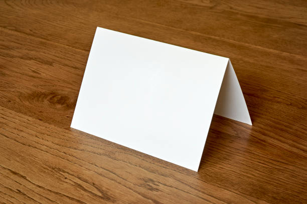 istock Empty greeting card mock up wooden background 1220272945