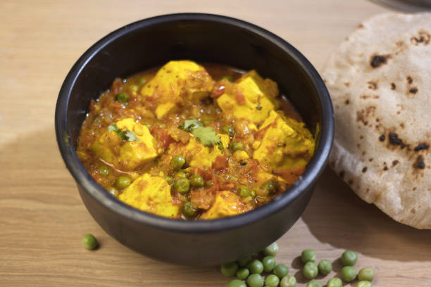 istock Mattar paneer, also known as matar paneer, and mutter paneer is a vegetarian North Indian dish consisting of peas and paneer in a tomato gravy 1220273205