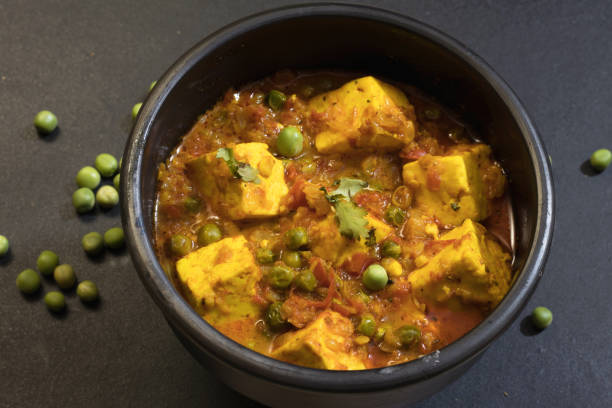 istock Mattar paneer, also known as matar paneer, and mutter paneer is a vegetarian North Indian dish consisting of peas and paneer in a tomato gravy 1220273235