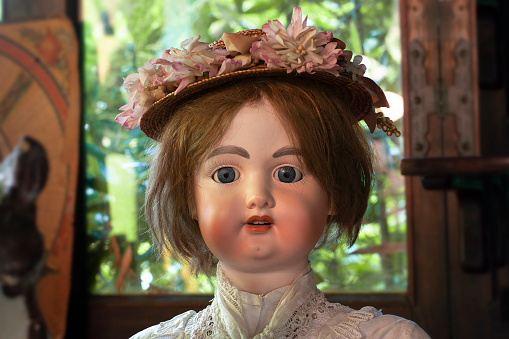 Vintage & antique toys. Retro porcelain doll close up.