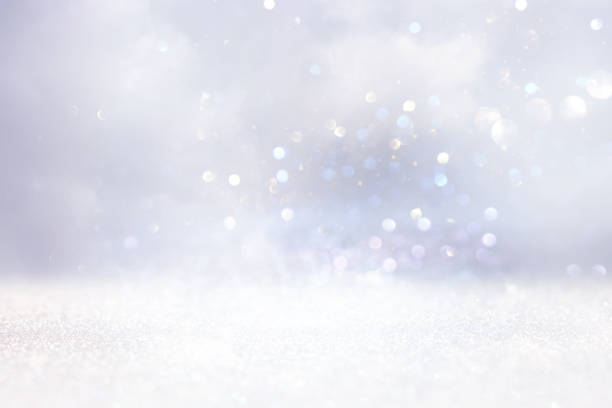 istock glitter vintage lights background. gold, silver and white. de-focused 1220274503