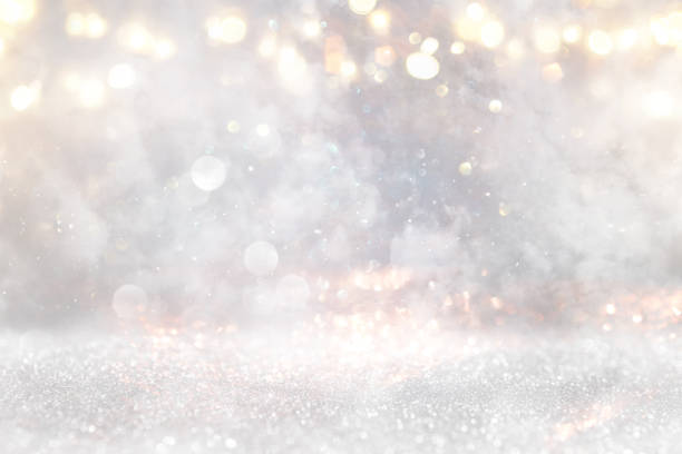 istock glitter vintage lights background. gold, silver and white. de-focused 1220274509