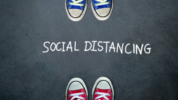 istock Social distancing. two people keep spaced between each other for social distance, increasing the physical space between people to avoid spreading illness during transmission of COVID-19 outbreak 1220275839
