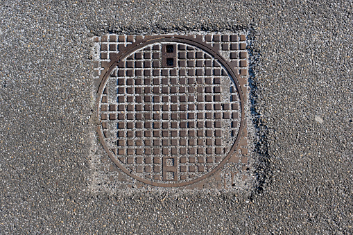 Rusty manhole cap, grunge manhole cover square