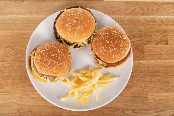 istock Tasty burger and fries 1220277738
