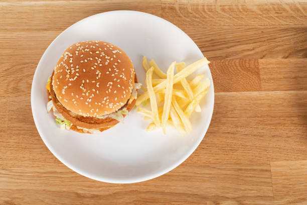 istock Tasty burger and fries 1220278076