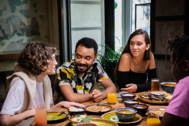 istock A multi-ethnic group of friends celebrating something in a cafe 1220278795