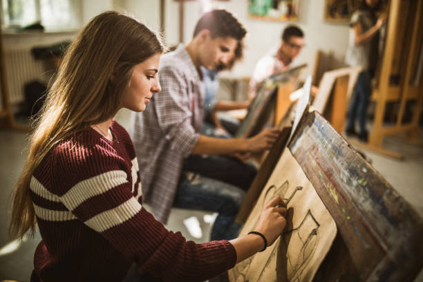 istock Female art student drawing a painting at art studio. 1220278836