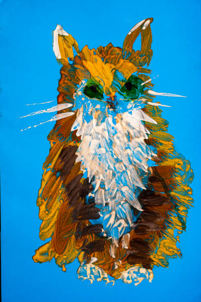 istock the children's drawing shows a cat. Blue sheet of paper brown orange white gouache. horizontal 1220278917