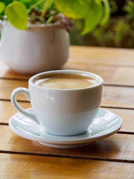 istock Hot coffee americano on the old wooden table 1220281719