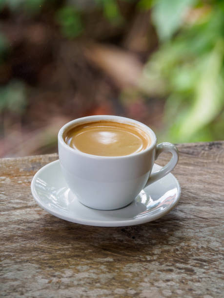 istock Hot coffee americano on the old wooden table 1220281730