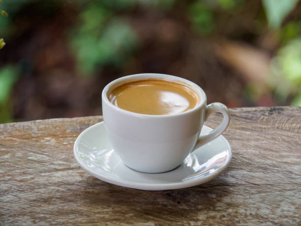 istock Hot coffee americano on the old wooden table 1220281742