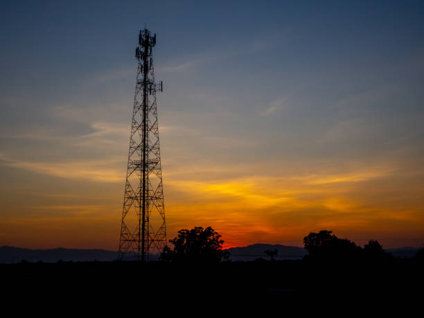 istock Silhouette view of cellphone antenna under twilight sky 1220283119