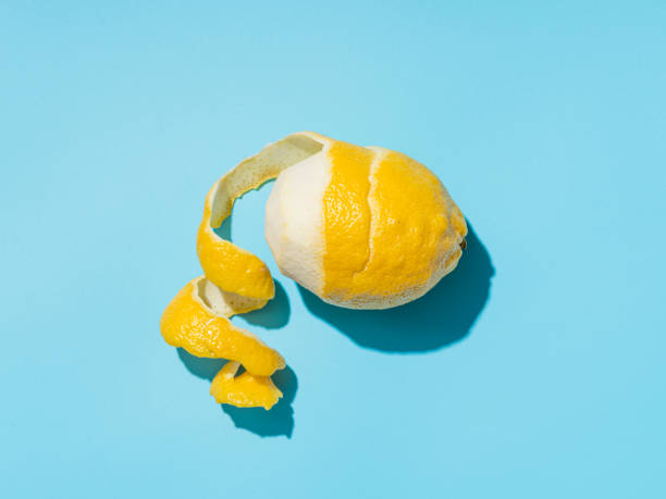 istock Lemon and spiral peel on blue background hardlight 1220283505