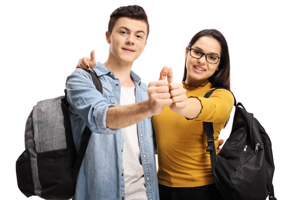istock Male and female students joining thumbs up 1220287382