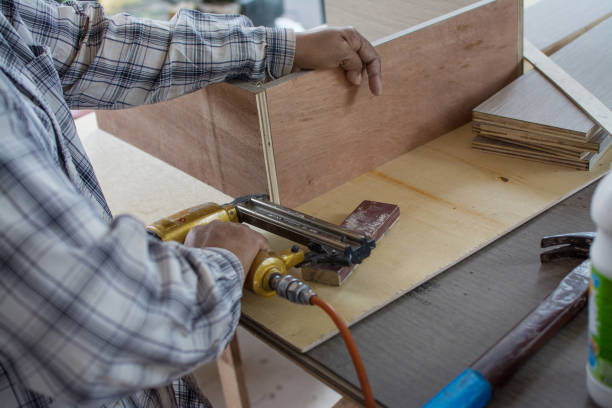 istock carpenter use air-gun for make new furnitur 1220287466