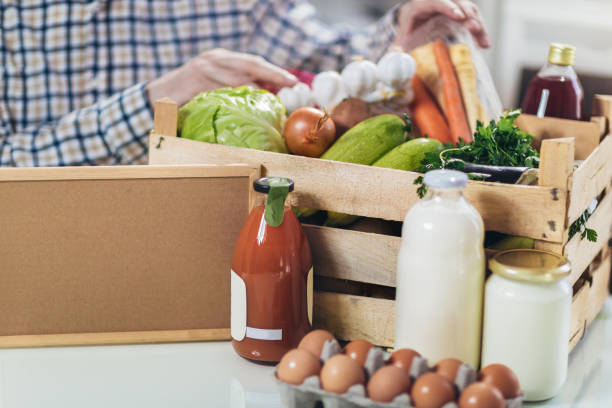 istock Fresh organic groceries in a wooden box. 1220287626