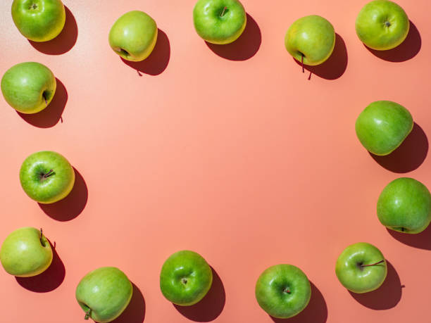 istock Bright backgroud with apples, copy space in center 1220289361