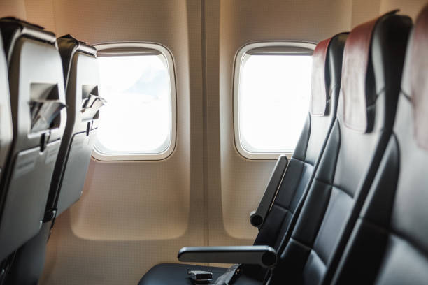 istock seats and a window inside the aircraft 1220290860