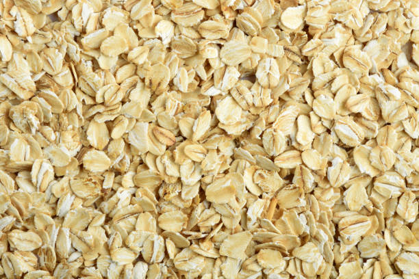 istock Oatmeal, full frame oat flakes background 1220294944