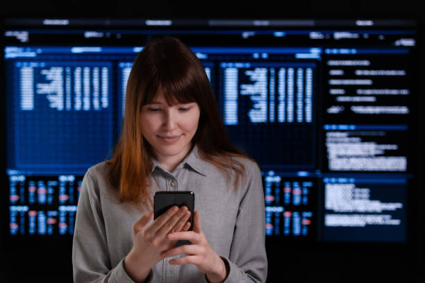 istock A smiling girl holds the phone in her hands 1220296929