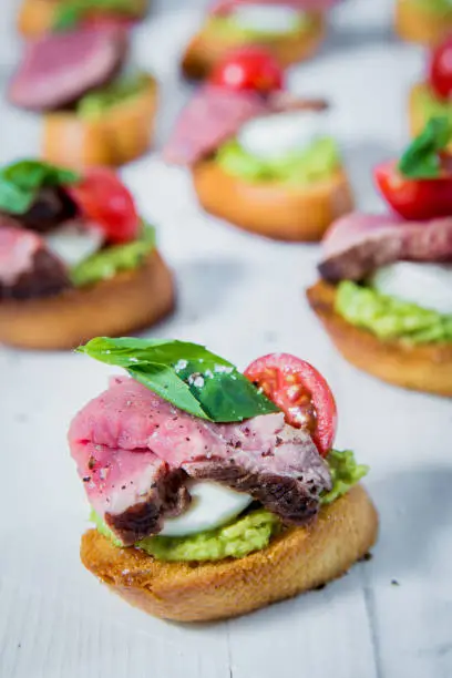 Photo of Beef Bruschetta served with haloumi and pesto.