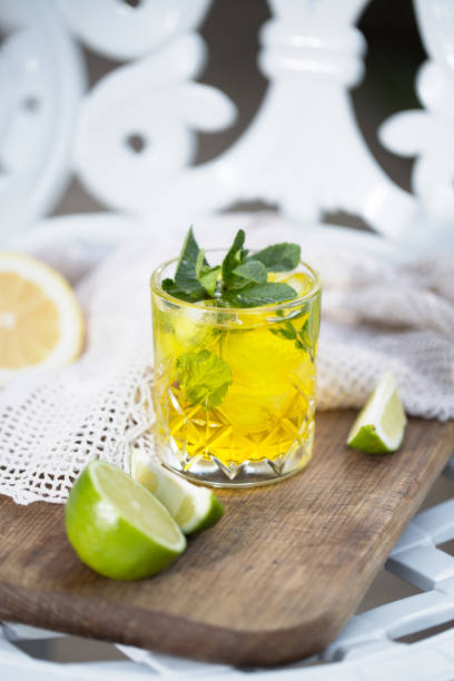 istock Yellow cocktail with mint leaves in it 1220298172