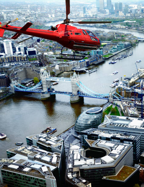 istock Helicopter Flying over Tower Bridge, London, UK. 1220298249