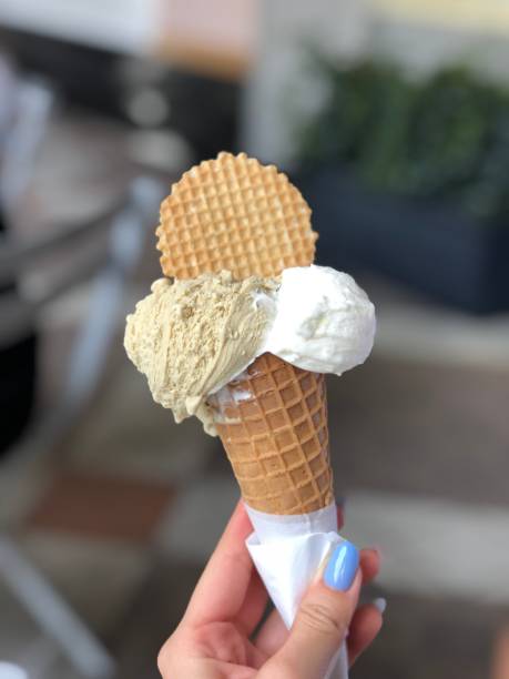 istock Front view of real edible ice cream cone with 3 different scoops of ice cream (vanilla, chocolate, strawberry) 1220298632