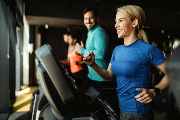 istock People running on treadmill in gym doing cardio workout 1220298701