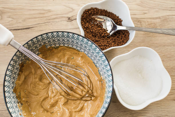Popular Korean Dalgona coffee ingredients on a wooden table, top view