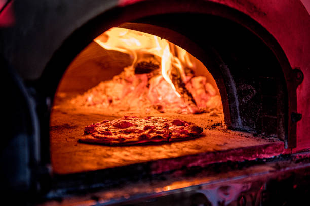 istock Pizza cooking in Pizza oven 1220302313