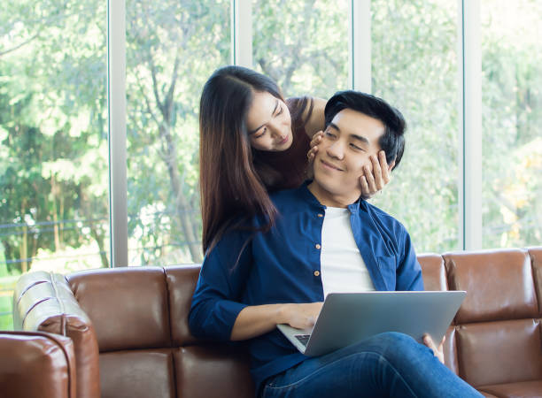 istock A couple is sitting in living room 1220302711