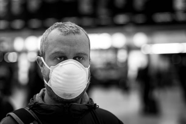 istock Man wearing protective face mask in city subway station 1220303241