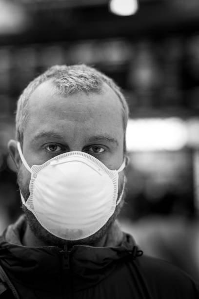 istock Man wearing protective face mask in city subway station 1220303246