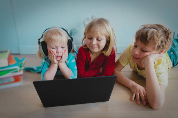istock kids learning online with computer, family staying home 1220304500