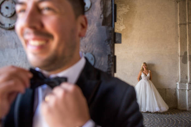 istock Beautiful happy wedding couple posing in old castle 1220305879