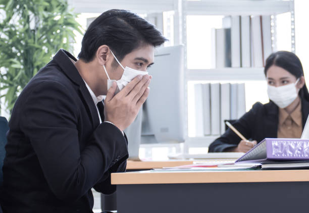 istock A business man is getting sick in office 1220306470