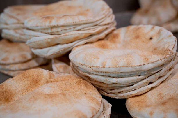 istock Kuboos or khubz - fresh pita bread togeather in a table 1220310437