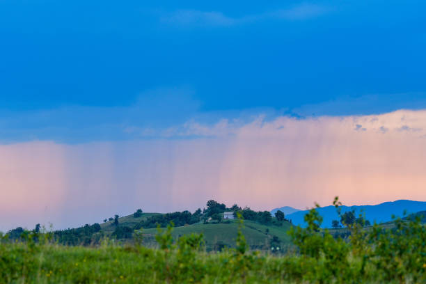 istock Rural landscape with rain storm over the meadow 1220311274