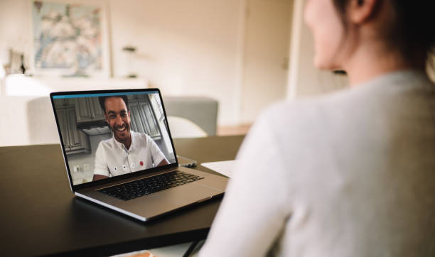 istock Couple having video call on laptop 1220313915
