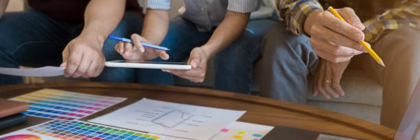 istock Graphic design and color swatches and pens on a desk. Architectural drawing with work tools and accessories. 1220313930