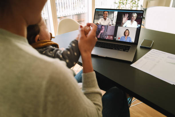 istock Woman at home video conferencing with colleagues 1220314106