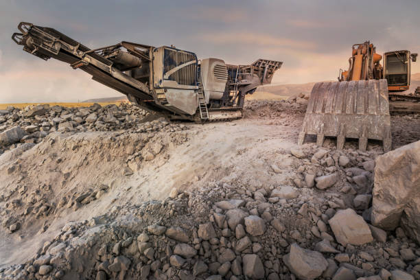 istock Quarry aggregate with heavy duty machinery. 1220314399