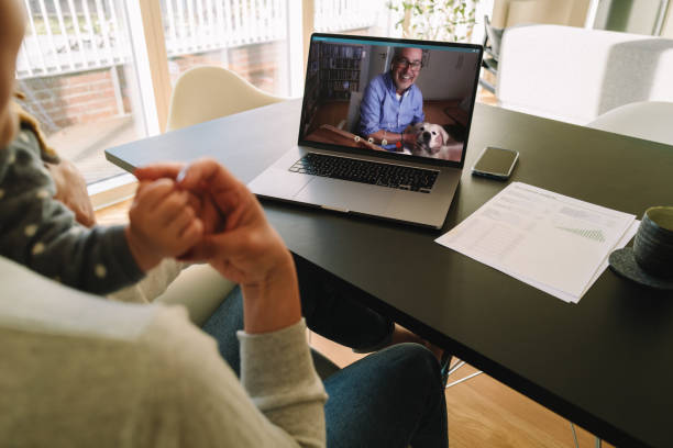 istock Woman having a video call with her father 1220314447