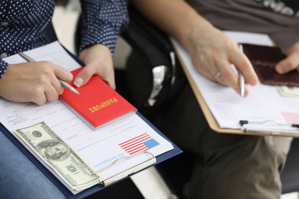 istock Couple preparing to fill out visa application form 1220314859