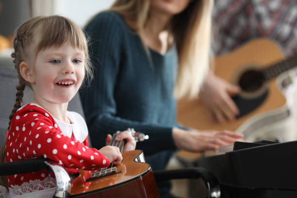 istock Baby learns play musical instruments with parents 1220314866