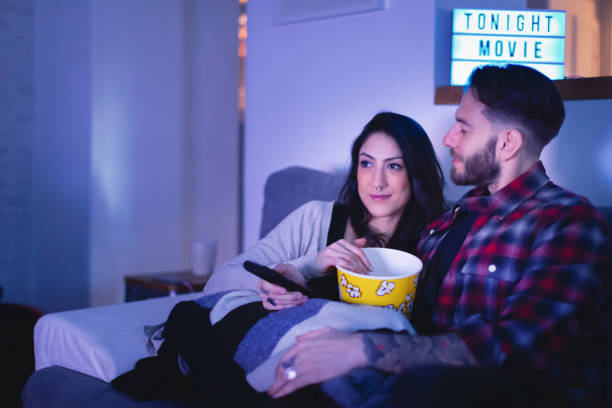 istock Couple Watching Movie 1220316172