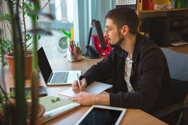 istock Caucasian entrepreneur, businessman, manager working concentrated in office 1220317451