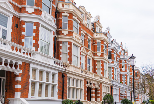 A street made up of brick-built apartments and townhouses in South Kensington, London.
